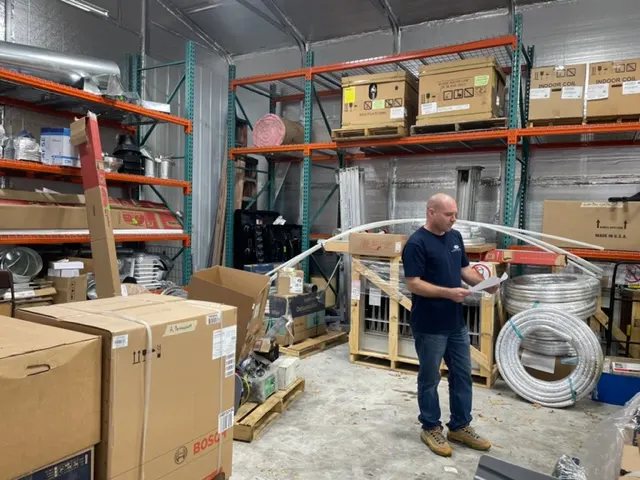 DG Service parts warehouse with a technician checking stock